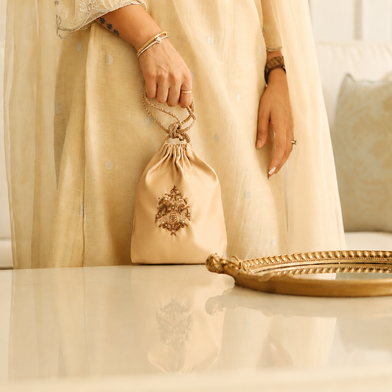 Inayaa – Champagne Gold Hand-Embroidered Zardozi Potli Bag